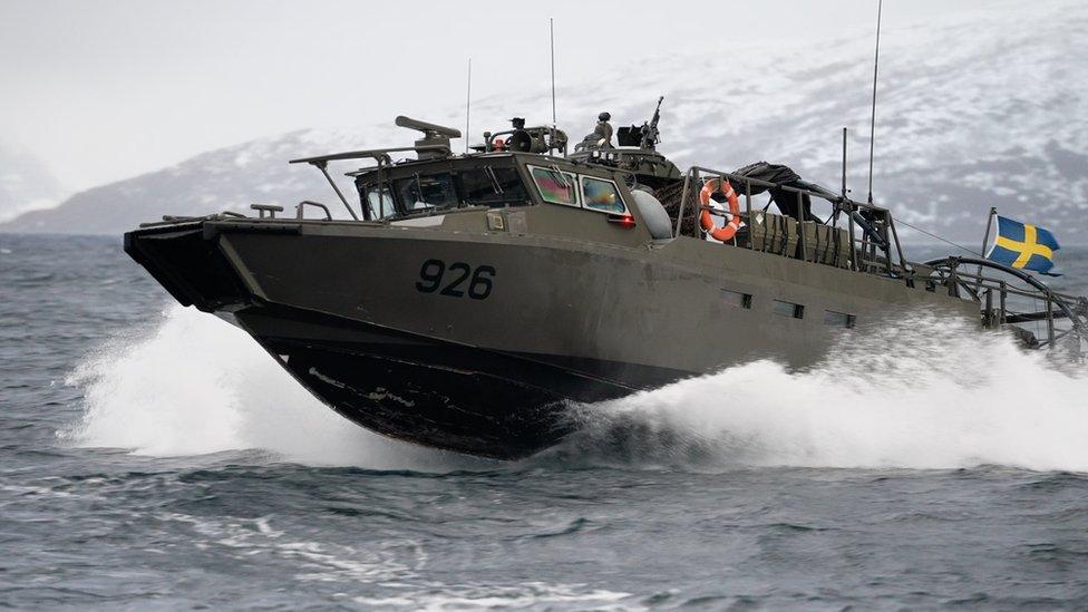 A combat boat moving in a Norwegian fjord