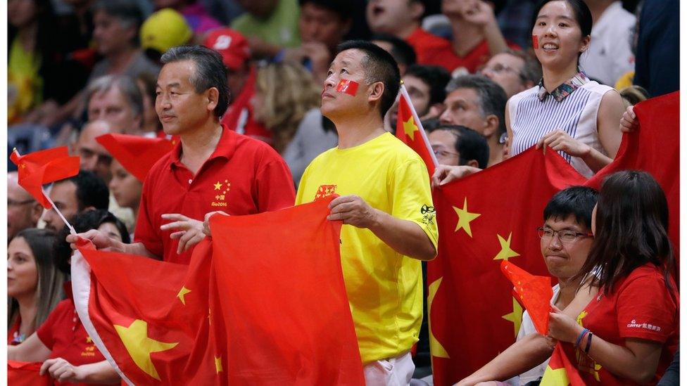 China fans look on during the Women's Volleyball semi-final match at the Maracanazinho, 18 August 2016, in Rio de Janeiro, Brazil.