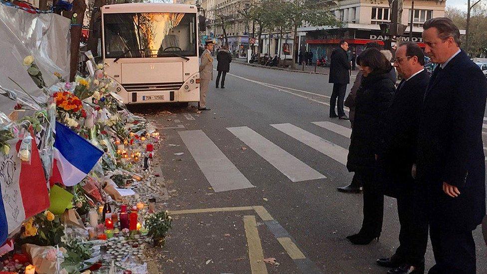 David Cameron with French President Francois Hollande paying their respects outside the Bataclan in Paris (23 November 2015)