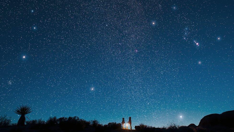 Two-children-looking-at-a-starry-morning-sky