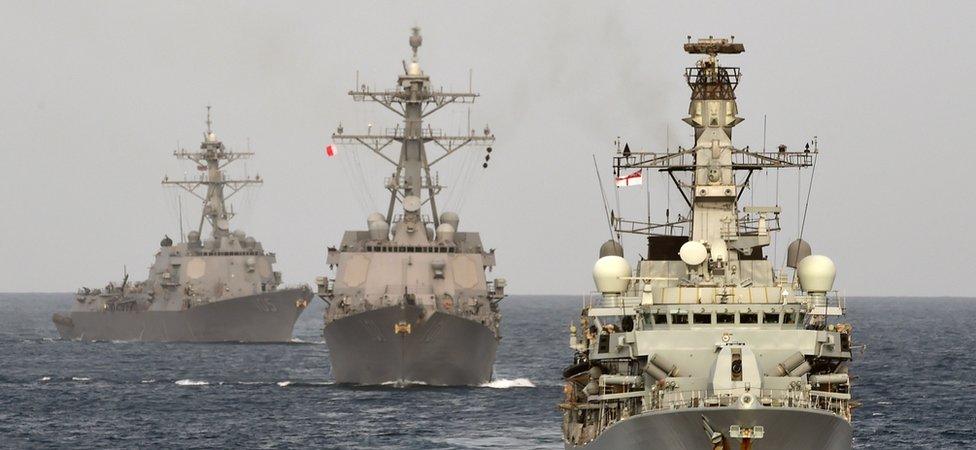 A British Naval ship at sea with Bahraini vessels