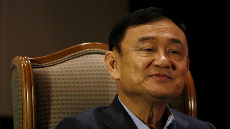 Former Thai Prime Minister Thaksin Shinawatra looks on as he speaks to Reuters during an interview in Singapore February 23, 2016.