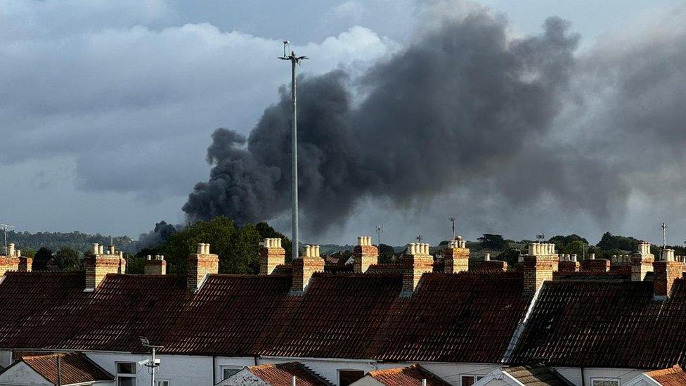 Smoke seen over roof tops