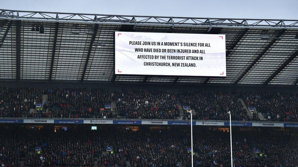 A large sign explaining a minutes silence will be held in respect of those who died in the Christchurch terror attack.