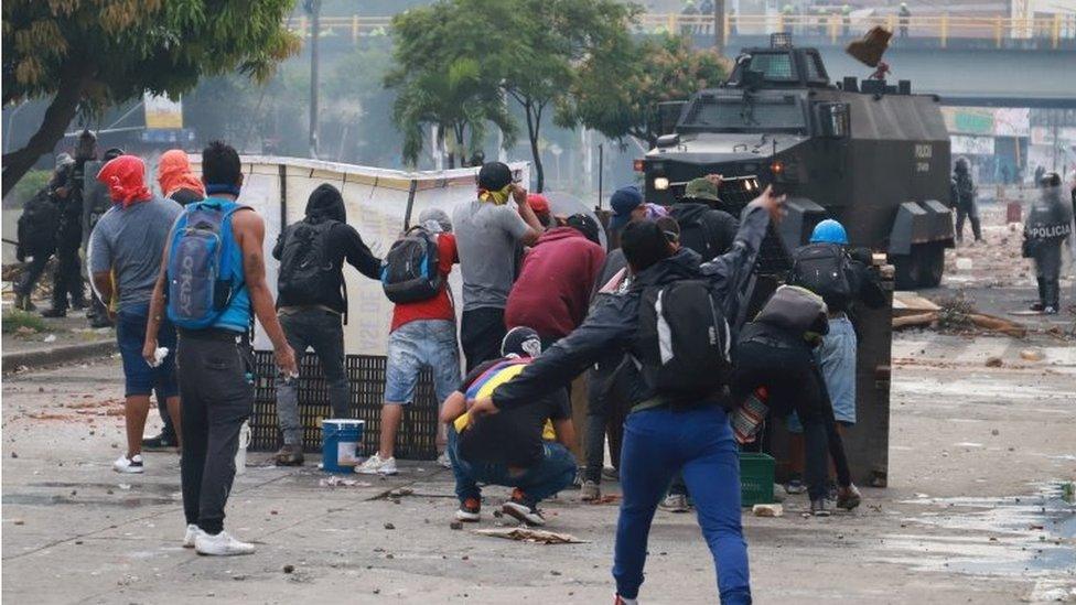 Demonstrators clash with members of the security forces during a protest against what they say was police brutality exerted in recent protests against President Ivan Duque"s government"s tax reform in Cali, Colombia May 3, 2021.