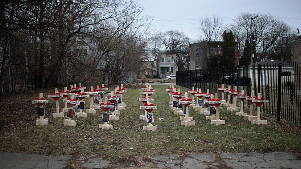 Forty-three crosses sit in a vacant lot in the Englewood neighborhood on January 23, 2017 in Chicago, Illinois.