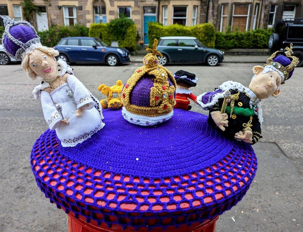 King Charles and Queen Camilla in their knitted finery