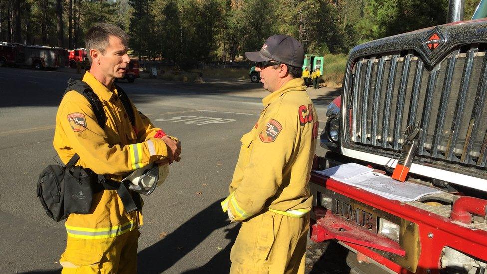 British firefighter Andy Elliot speaks to another firefighter in California on 15 September 2015.