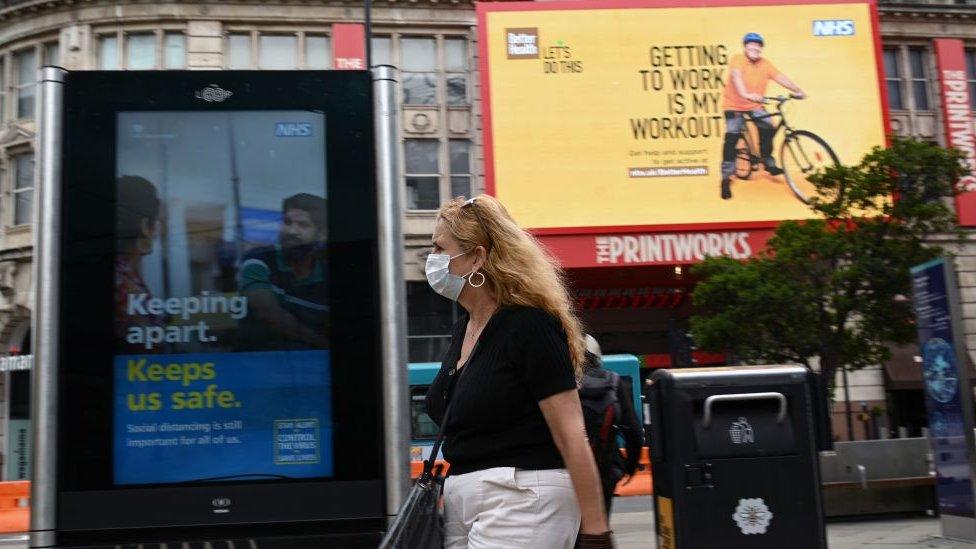 Woman walking through Manchester