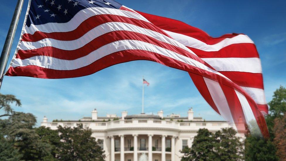 American flag in front of the White House in Washington D.C.