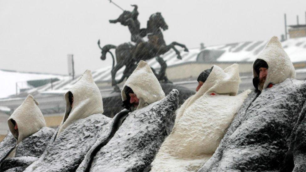 Ethnic Balkar men wearing their traditional winter cloaks brave the snowfall as they protest against the policies of their local authorities in Moscow on December 9, 2010. Representatives of seven Balkar villages are in the fourth month of a hunger strike to call attention to what they call the violation of the traditional land-use rights by officials in Kabardino-Balkaria