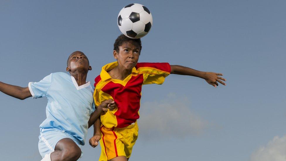 Boys playing football