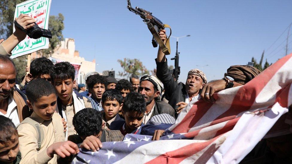 Supporters of Yemen's rebel Houthi movement protest in Sanaa against a decision by the Trump administration to declare it a foreign terrorist organisation (18 January 2021)