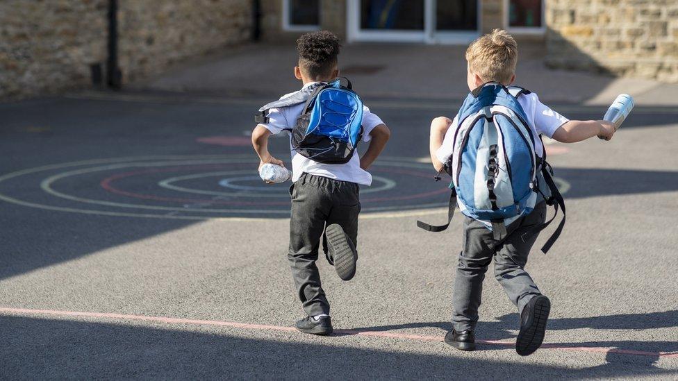 anonymous school children in the playground