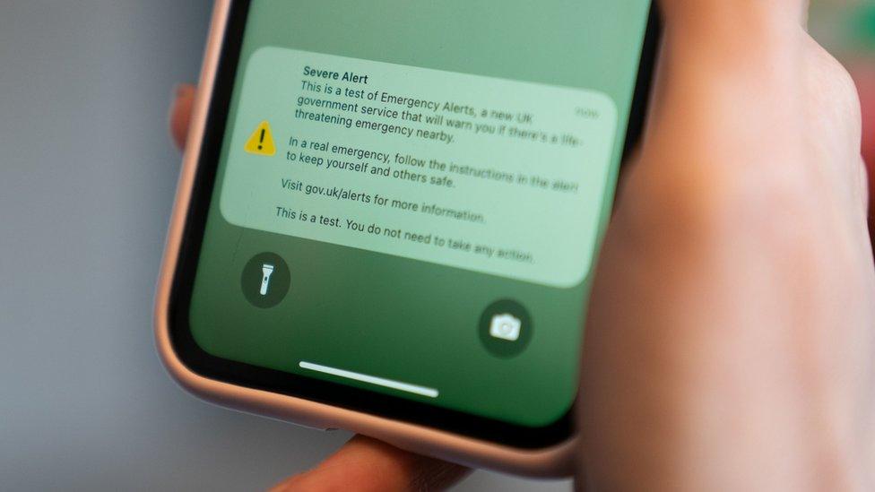 A test of a new public alert system emitting a loud alarm on a mobile phone in Burton Latimer, Northamptonshire