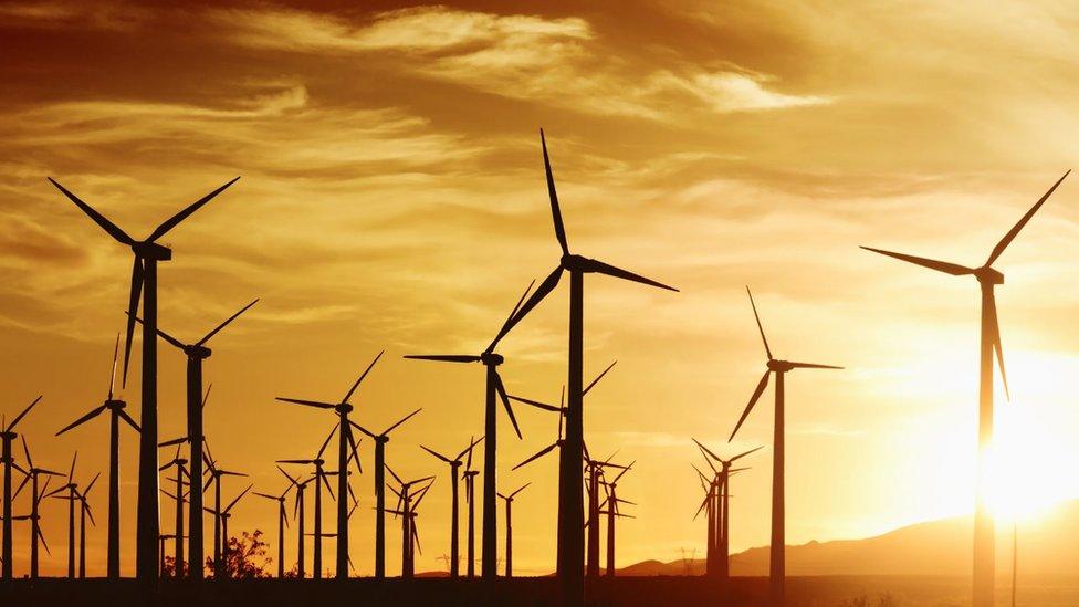 wind turbines at sunset