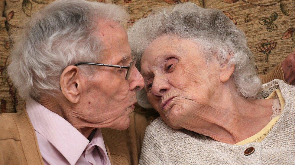 Ken and Margaret Harris kiss