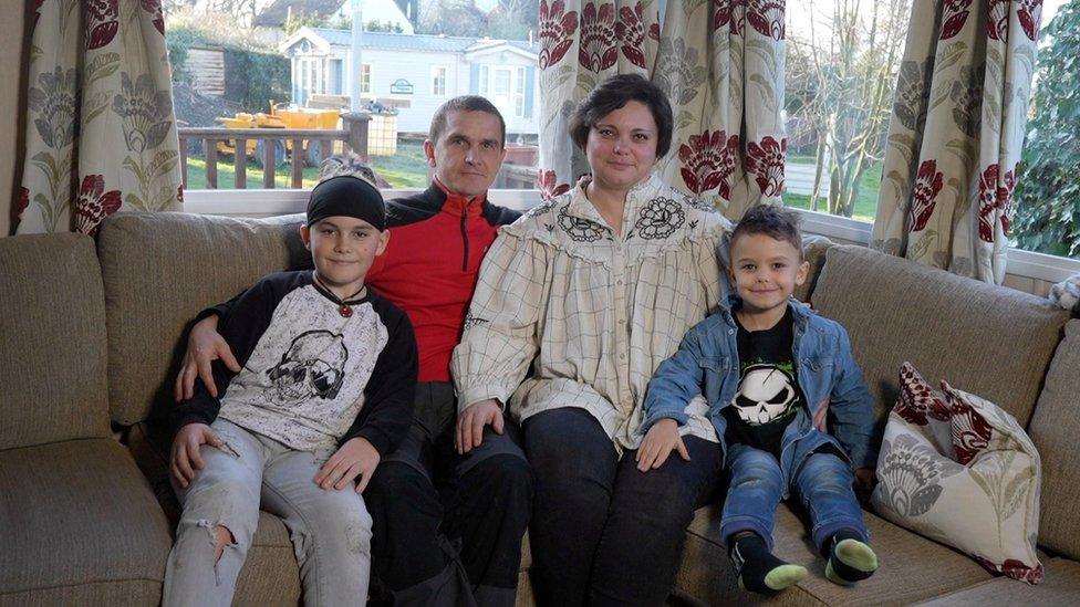 The Yevstihnieieva family. 10-year-old Nazar, his father Dmydro, his mother Hanna and 4-year-old Daniil