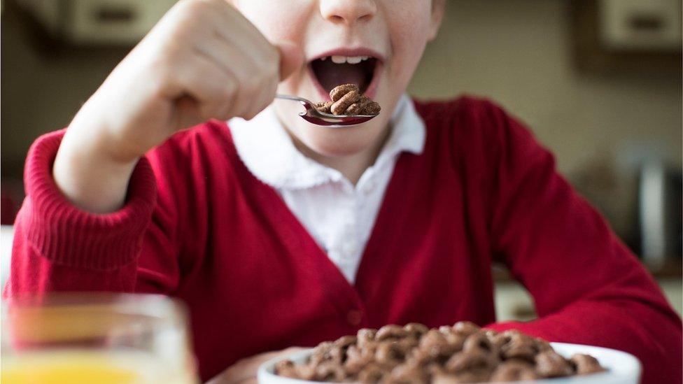 Child eating breakfast