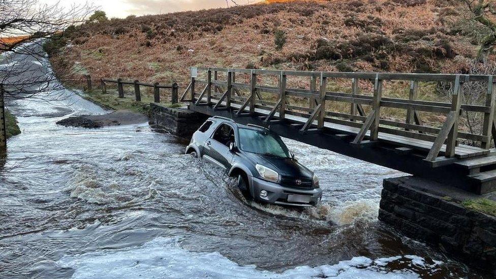 Car in flood waters