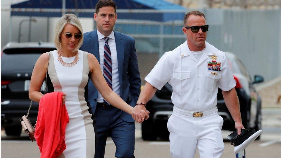 Navy SEAL Special Operations Chief Edward Gallagher arrives at court with his wife Andrea and brother Sean (C) for the start of his court-martial trial at Naval Base San Diego in San Diego, California