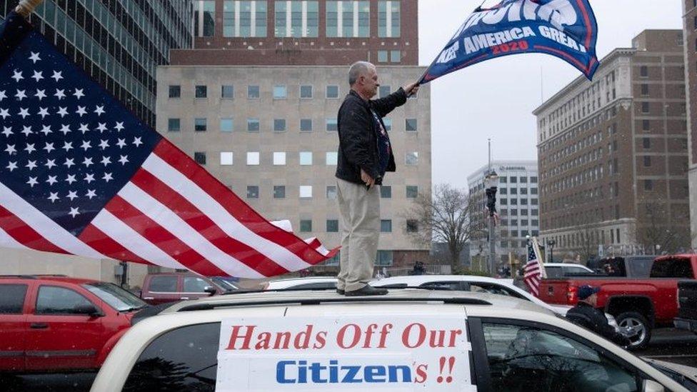 A man in Lansing, Michigan, protests against restrictions imposed in the US state