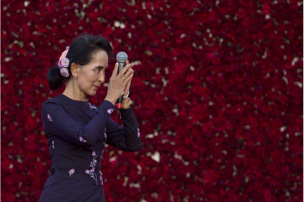 In this Sunday, 1 November 2015, file photo, Myanmar opposition leader Aung San Suu Kyi greets supporters before delivering a speech during a campaign rally of her National League for Democracy party in Yangon, Myanmar