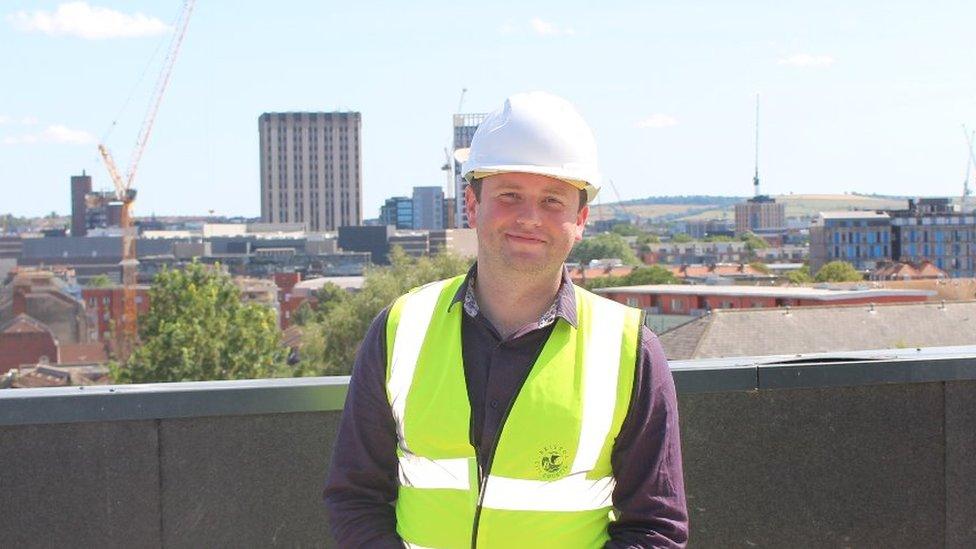 Tom Renhard wearing construction site safety gear