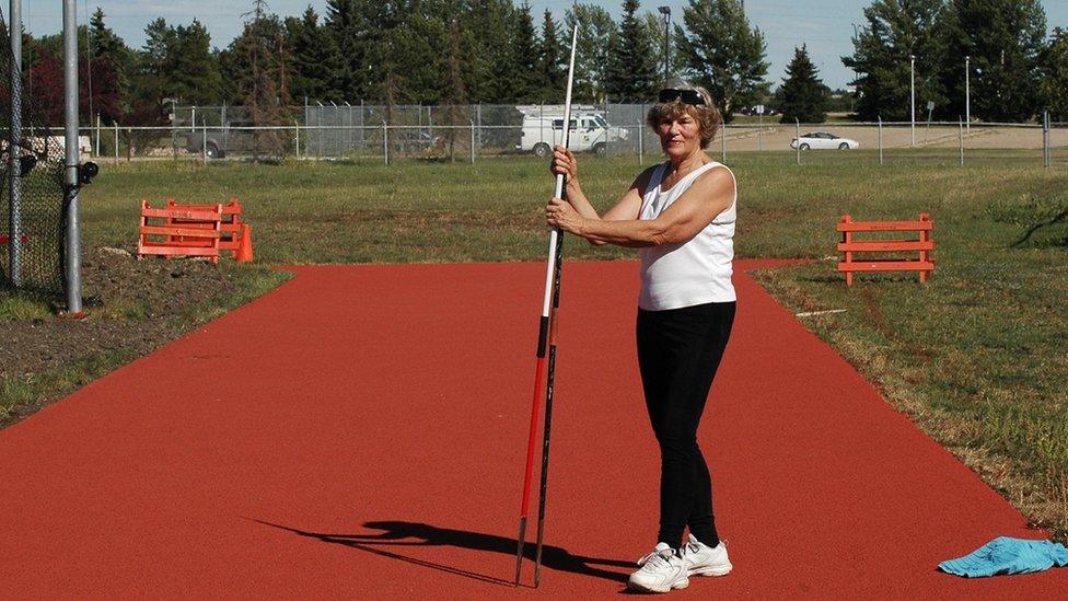 Margaret Tosh is seen in a field at a javelin throw practice.