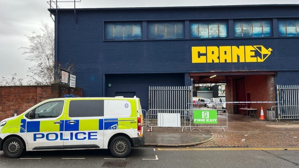 A police van outside The Crane nightclub