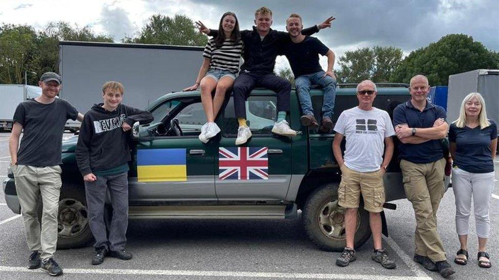 Fynn Watt with people from the most recent convoy he organised