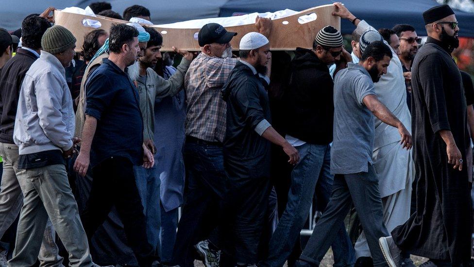 A coffin containing the body of a victim of the Christchurch terrorist attack is carried for burial at Memorial Park Cemetery on March 20, 2019 in Christchurch