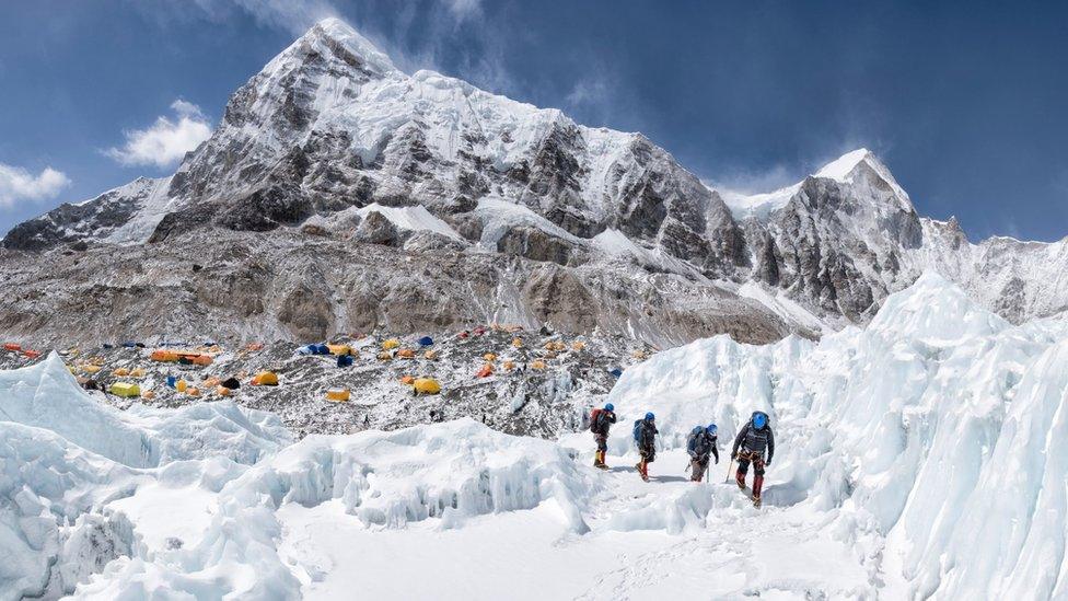 Climbers leaving base camp