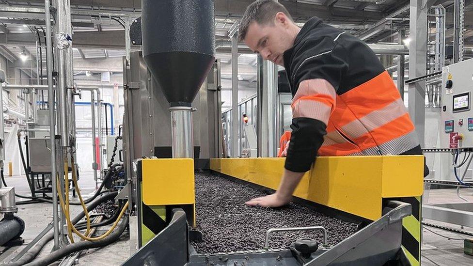 Joseph Eccleston from Innovate Recycle sorting through polypropylene pellets