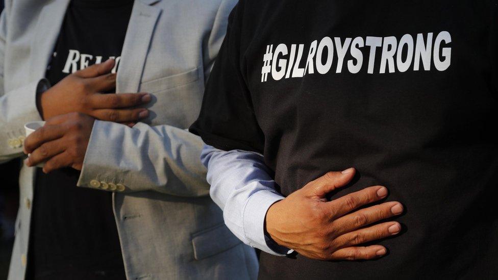 Gilroy residents behind the Gilroy City Hall during a vigil for victims