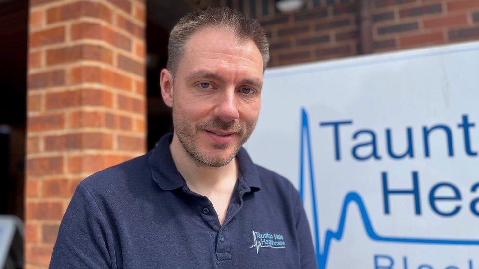 a man outside a doctors surgery