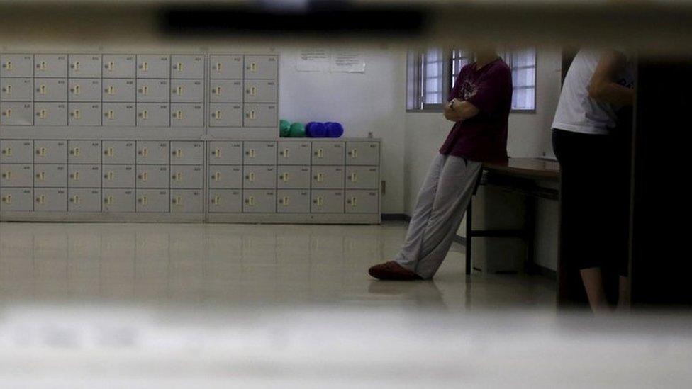 A detainee seen through a hatch at a Tokyo immigration centre