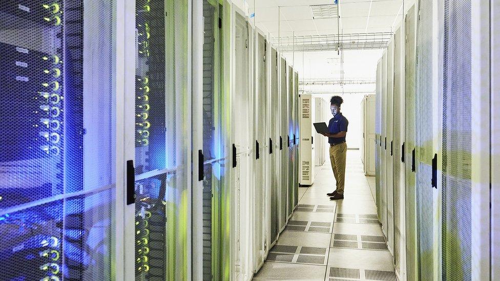 A stock photograph of a data centre interior