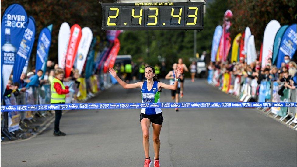 Fionnuala Ross crosses the finish line