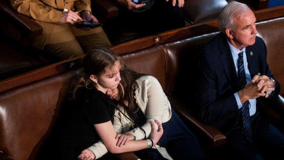 Children are seen on the House floor during a vote