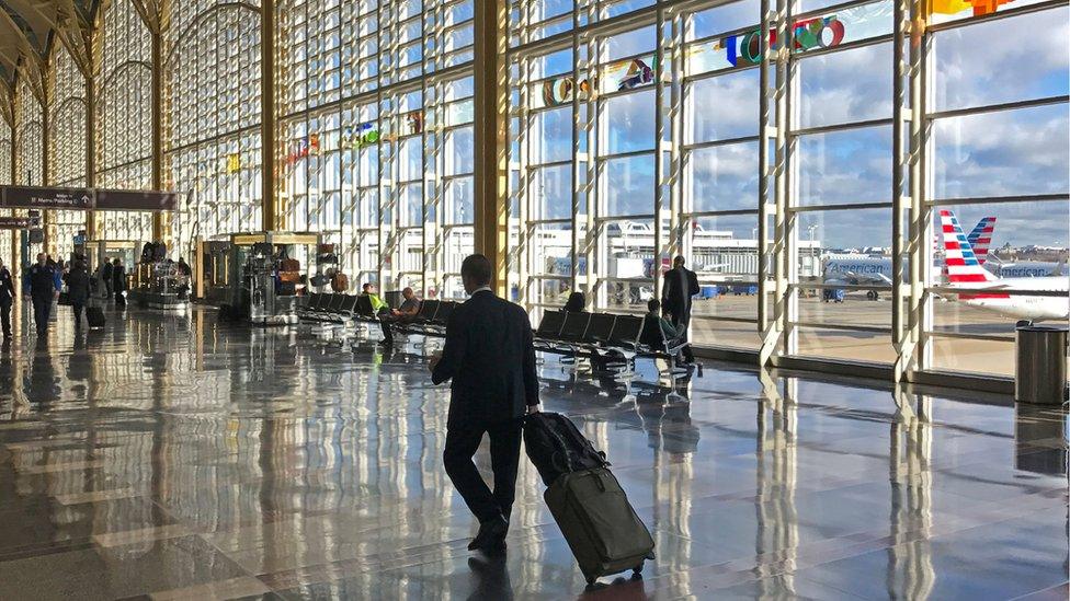 A traveller walks through the Washington DC airport