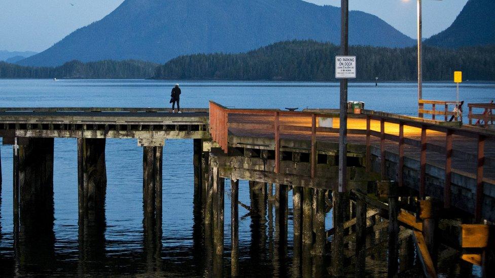 Woman on dock in Tofino