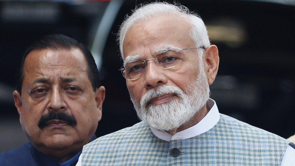 India's Prime Minister Narendra Modi (R) addresses the media on the special session of Parliament in New Delhi. (P