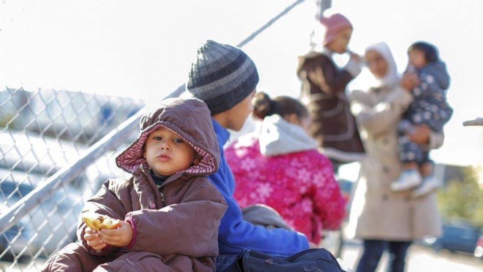 Passengers, among them migrants and refugees, exit the German ferry terminal in Goteborg, Sweden (September 2015)