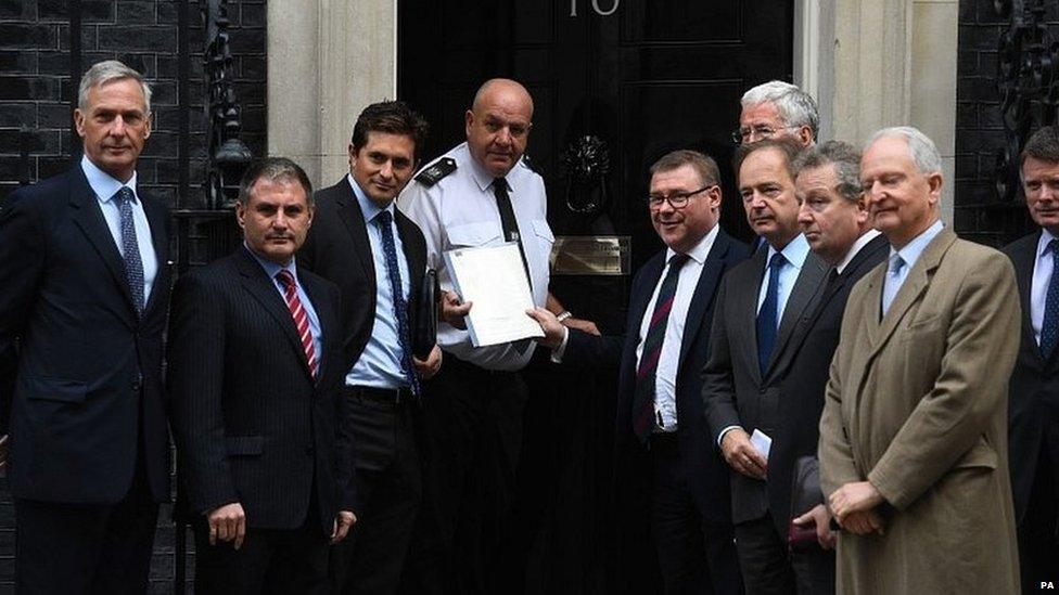 A group of former ministers hand in a petition to Downing Street