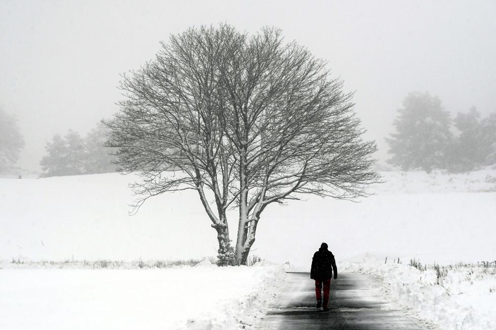 A man walks along a path at Gleneagles golf course in Scotland on 14 January 2021