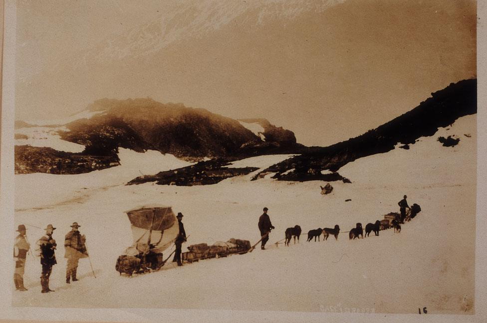 A dog team travels from Alaska into British Columbia in 1900