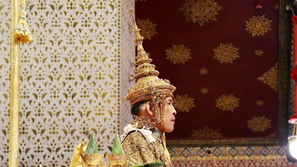 Thailand"s King Maha Vajiralongkorn sits on the throne during his coronation inside the Grand Palace in Bangkok