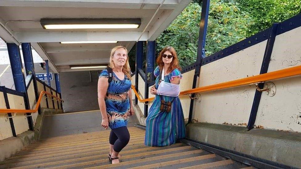 Jacky Dempsey (right) with her friend Anne Cassels on the stairs at Pokesdown