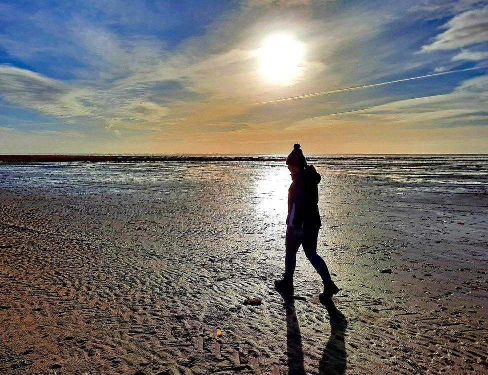 A girl silhouette on a beach